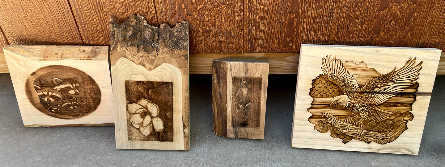 A woodworker carefully examines different types of wood, comparing their grain and texture for laser engraving